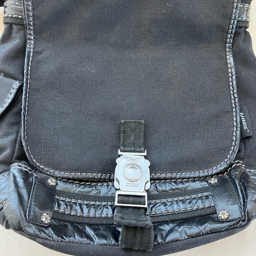 Black Crossbody Bag with Flap-Over Design and Buckle Closure